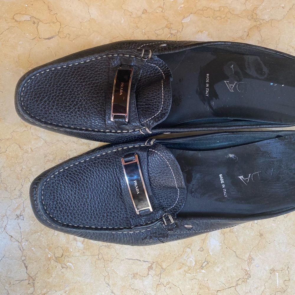 Prada black leather mule with silver hardware in size 10. Gently worn.